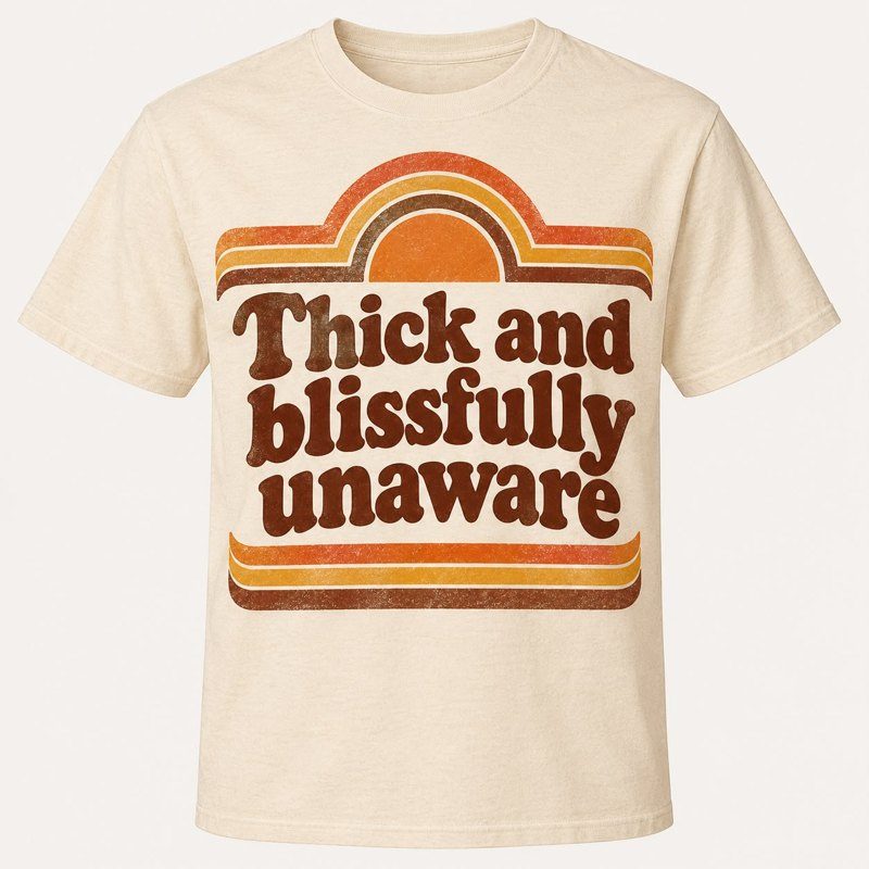 Cream tee with retro sunset print reading Thick and blissfully unaware